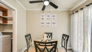 A dining area with a table, chairs, and ceiling fan. - < 2 Mi to ECU & Medical District: Retreat w/ Patio (Greenville)