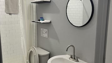 Shower, towels, soap, toilet paper