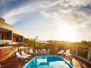 Outdoor pool, open 8:00 AM to 10:00 PM, pool loungers