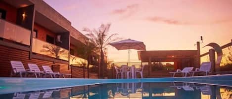 Outdoor pool, open 8:00 AM to 10:00 PM, sun loungers