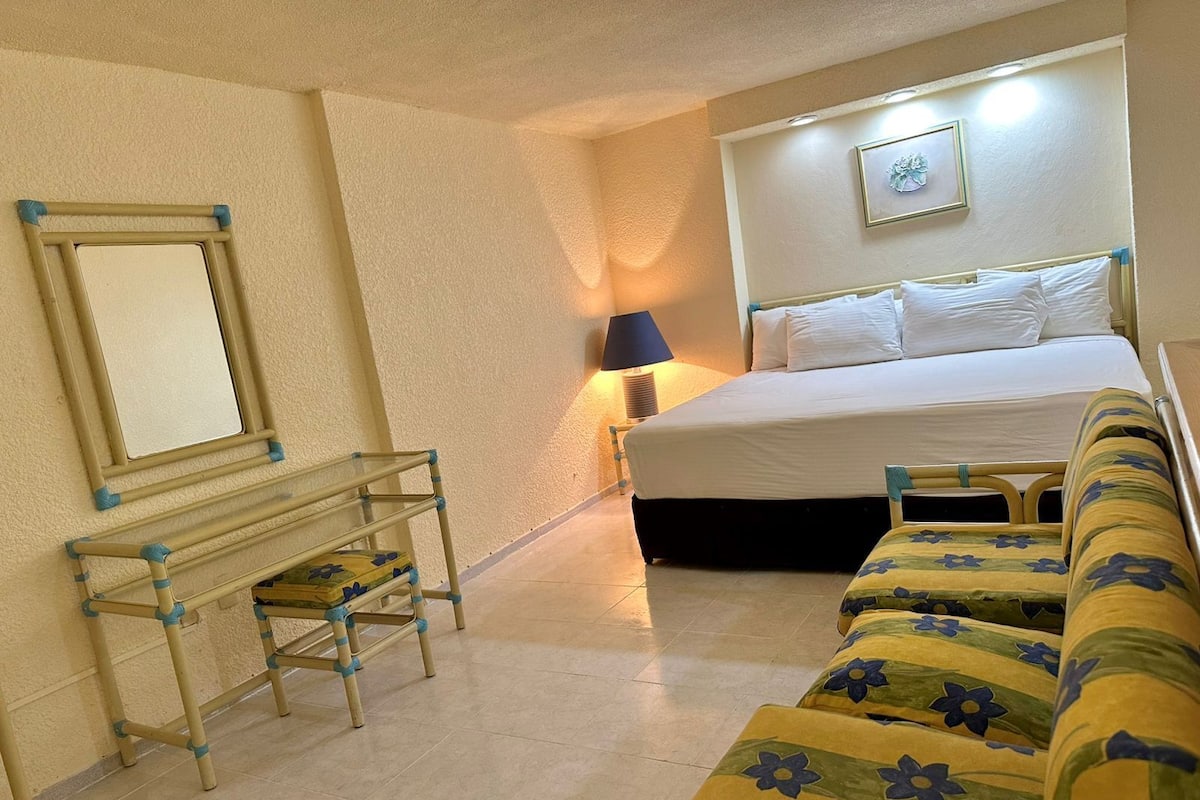 Suite, 1 King Bed with Sofa bed | In-room safe, desk, laptop workspace, iron/ironing board