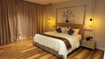 Premium bedding, memory foam beds, laptop workspace, blackout drapes