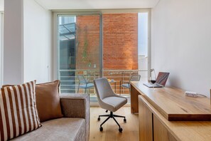 Standard Studio Suite | In-room safe, desk, laptop workspace, blackout drapes