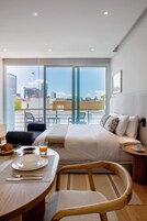 Design Studio Suite | In-room safe, desk, laptop workspace, blackout drapes