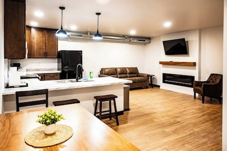 Interior. ADA Accessible Brillion 2‑Bedroom Suite w/ Full Kitchen Near Ariens – Unit #1