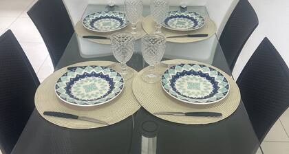 03 bedrooms (air conditioning and fan), up to 10 people, garage, behind the Unimed hospital