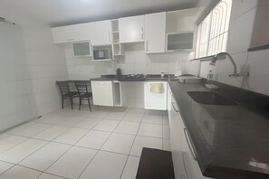 Fridge, microwave, cookware/dishes/utensils