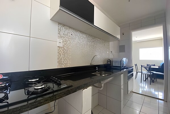 Fridge, microwave, cookware/dishes/utensils