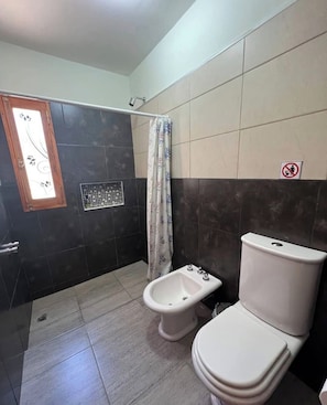 Shower, towels, soap, toilet paper