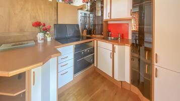 Fridge, stovetop, coffee/tea maker, cookware/dishes/utensils