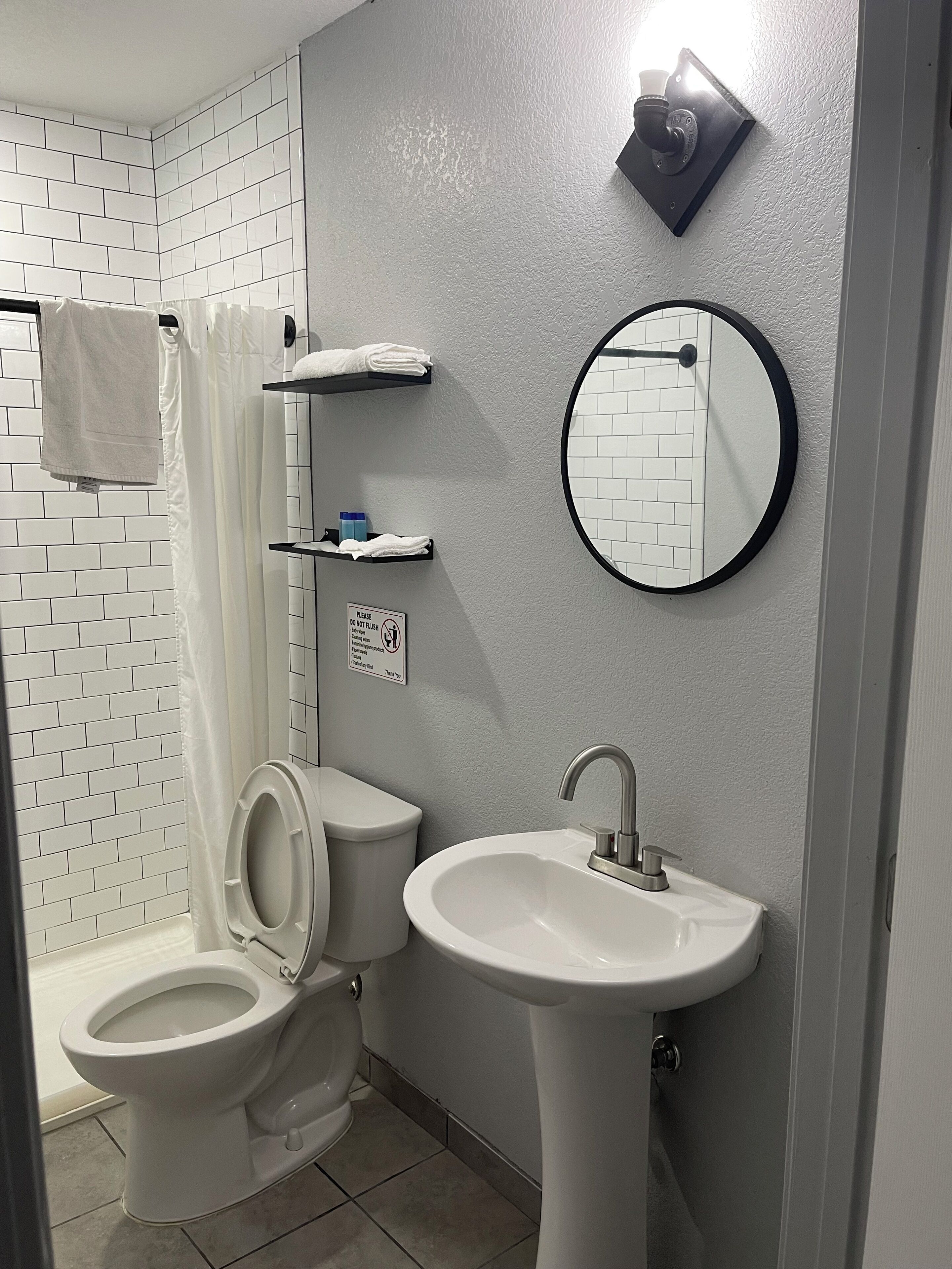 Shower, towels, soap, toilet paper