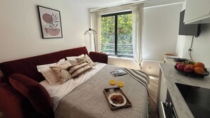 1 bedroom, desk, iron/ironing board, travel crib
