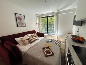1 bedroom, desk, iron/ironing board, travel cot