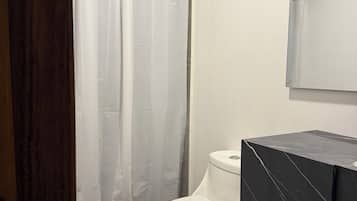 Shower, towels, toilet paper