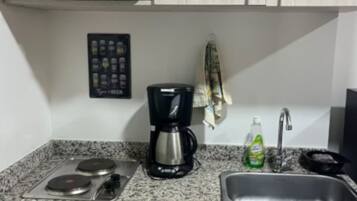 Fridge, coffee/tea maker, cookware/dishes/utensils