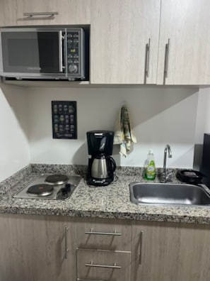 Fridge, coffee/tea maker, cookware/dishes/utensils