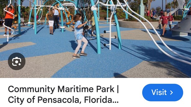 A playground with various play structures and a clock.