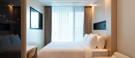 Desk, laptop workspace, free WiFi, bed sheets