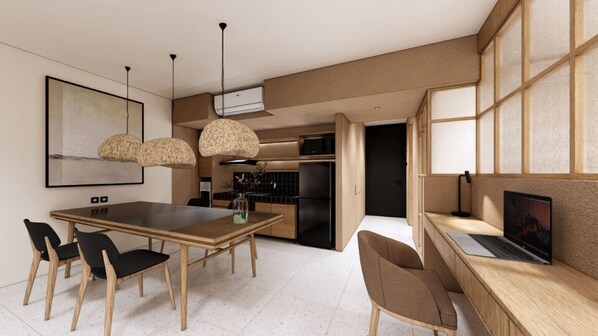 Une cuisine moderne avec un coin repas, comprenant une table en bois, des chaises et des luminaires suspendus.