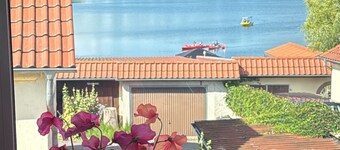 Groot vakantieappartement met uitzicht op het meer, gedeeld terras en wifi