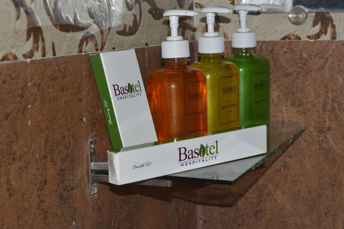 A display of hand soap bottles in a bathroom setting.