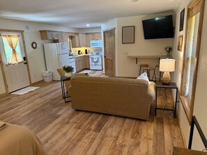 Signature Cabin, 1 King Bed with Sofa bed, Patio, Mountain View | Living area | 40-inch Smart TV with digital channels