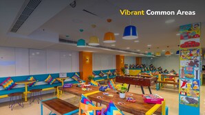 A vibrant children's play area with colorful furniture and educational posters. - goSTOPS Bengaluru Jayanagar (Bengaluru)