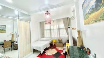 Comfort Room, City View | Desk, laptop workspace, iron/ironing board, free WiFi