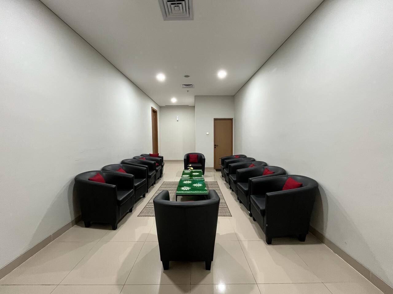A conference room with a long table and chairs arranged for meetings.
