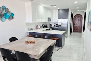 Coffee/tea maker, fridge, microwave, oven
