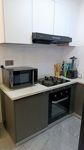 Luxury Apartment, City View | Private kitchen | Coffee/tea maker, electric kettle, dining tables - Capital Rise by Extended Stays (Nairobi)