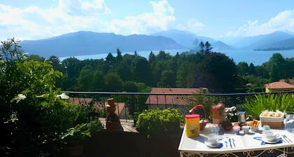 Penthouse with terrace overlooking lake, mountains and stars