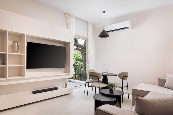 Glyfada Prime Apartment | Living area | 50-inch Smart TV with satellite channels, Netflix, streaming services