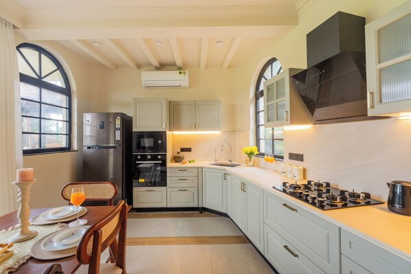 Fridge, coffee/tea maker, electric kettle, cookware/dishes/utensils
