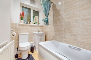 Shower, hair dryer, towels, toilet paper