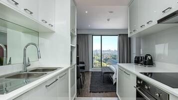 Monolocale Basic | Cucina privata | Frigorifero, microonde, forno, piano cottura