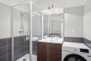 Shower, hair dryer, towels, soap