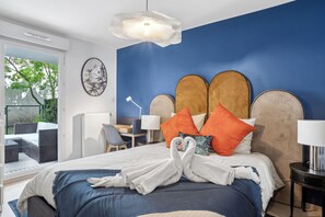 1 bedroom, desk, iron/ironing board, travel crib