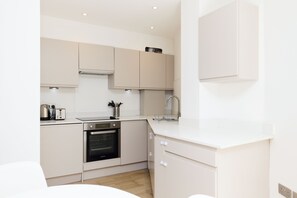 Apartamento, sacada | Cozinha privada