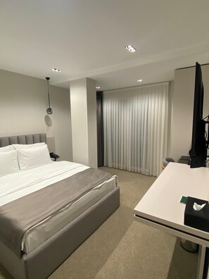 Desk, laptop workspace, blackout curtains, iron/ironing board