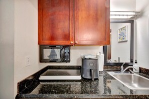 Microwave, stovetop, coffee/tea maker, cookware/dishes/utensils