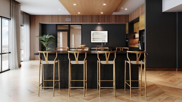 A modern kitchen with a wooden ceiling, black walls, and a bar area with wooden stools. - Regards At Med Center 130 I Spacious 1 Bed 1 Bath (Houston)