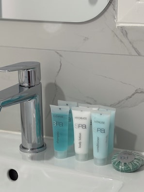 Shower, hair dryer, towels, soap