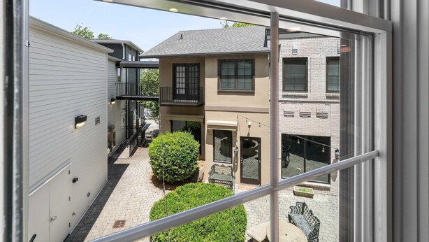 A view of a residential area with a two-story house, a covered patio, and a small garden. - Carters Court Serene Suite (Franklin)