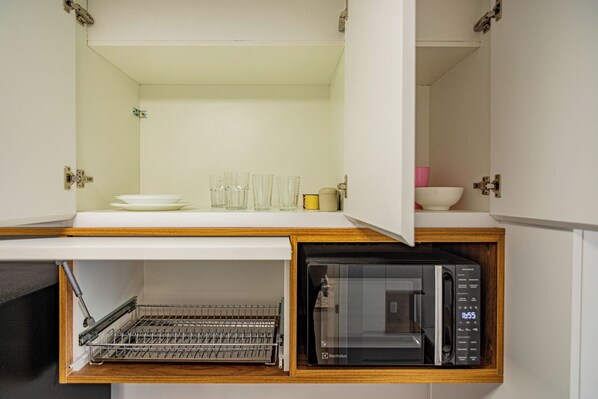 Fridge, microwave, stovetop, cookware/dishes/utensils