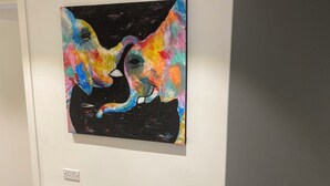 A colorful abstract painting on a white wall. - Remarkable 3-bed Apartment in London (Erith)