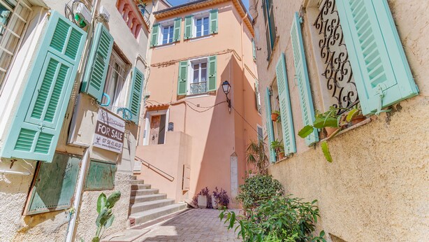 A narrow street with a 'For Sale' sign, a staircase, and buildings with green shutters. - AUTHENTIC VILLEFRANCHE AP4472 By Riviera Holiday H (Villefranche-sur-Mer)
