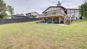 A two-story house with a covered patio and a wooden deck. - Lakefront Family Home 13 Mi From Gateway Arch! (Granite City)