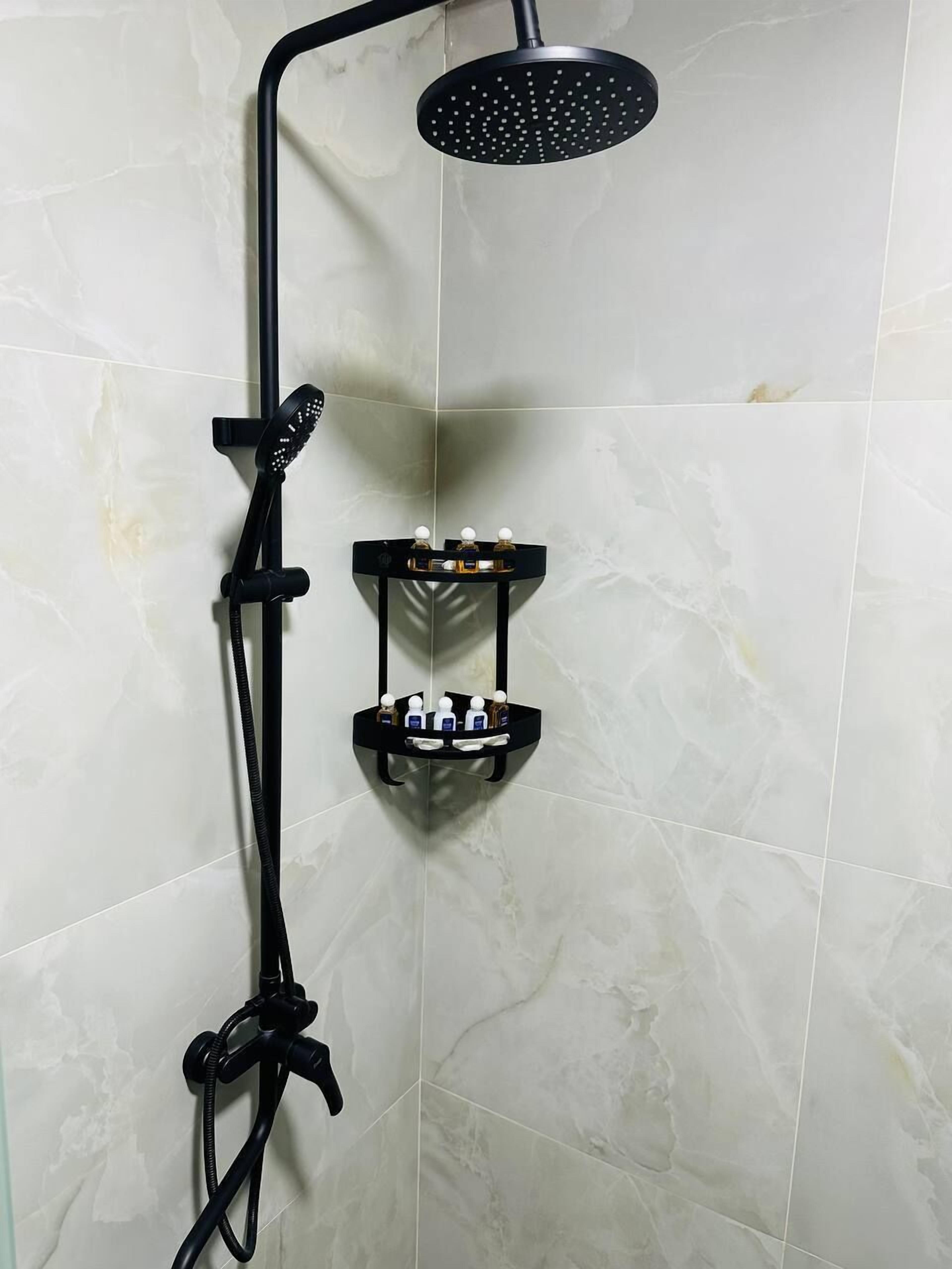 Bathtub, hair dryer, slippers, towels