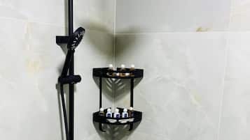 Bathtub, hair dryer, slippers, towels